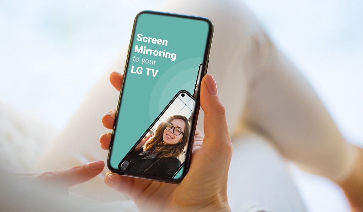 A hand holding an iPhone with an AirBeamTV promotional image on the screen