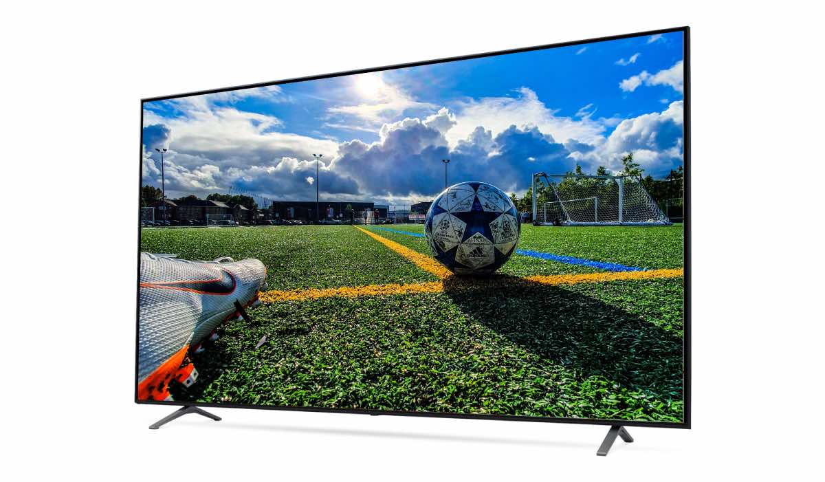 An LG TV with an image of a football pitch and a football on the screen